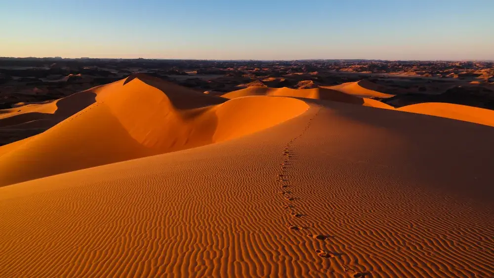 Tin Merzouga Sand dunes in the Sahara in the Tassili nAjjer National Park during the cheapest time to visit Algeria