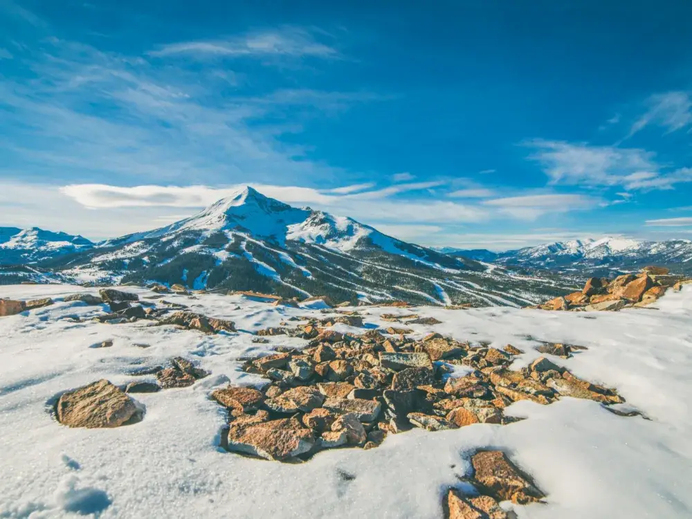 For a piece on the best time to visit Montana, Big Sky pictured with snow on the ground in the mountains