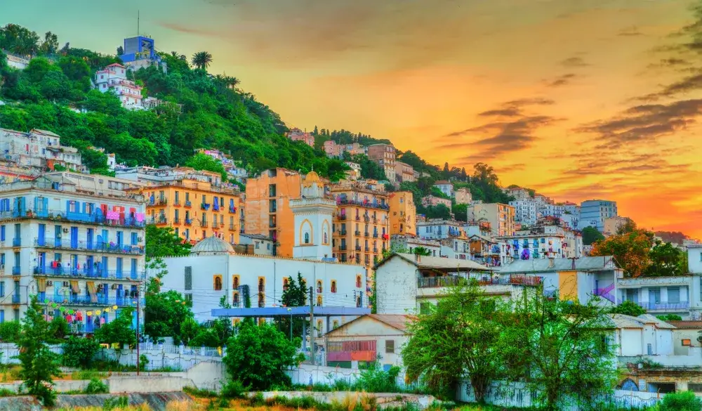 Sunset on the hills with colorful houses in Algiers during the best time to visit Algeria