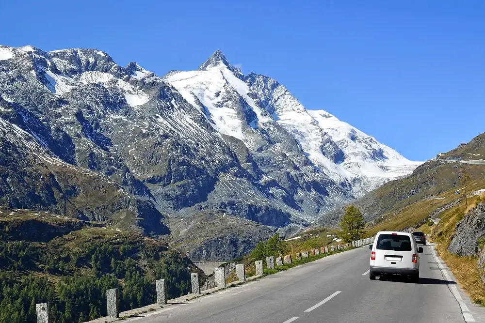 Van driving by the Pasterze Glacier on the Grosslockner High Alpine Road