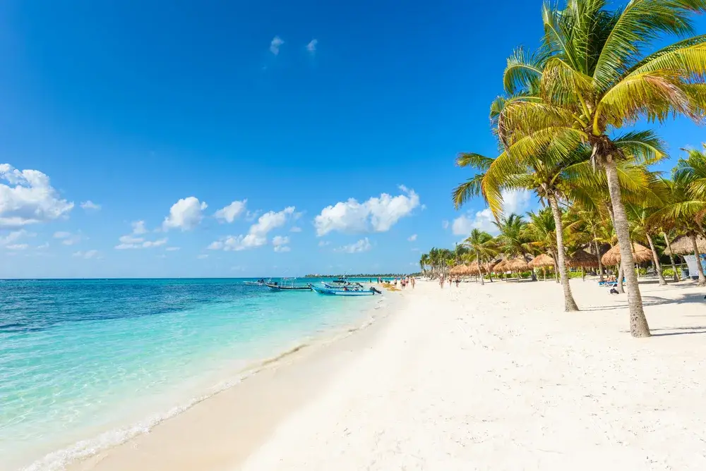 Idyllic view of a white sand beach in Riviera Maya for a piece titled Is Cancun Safe to Visit