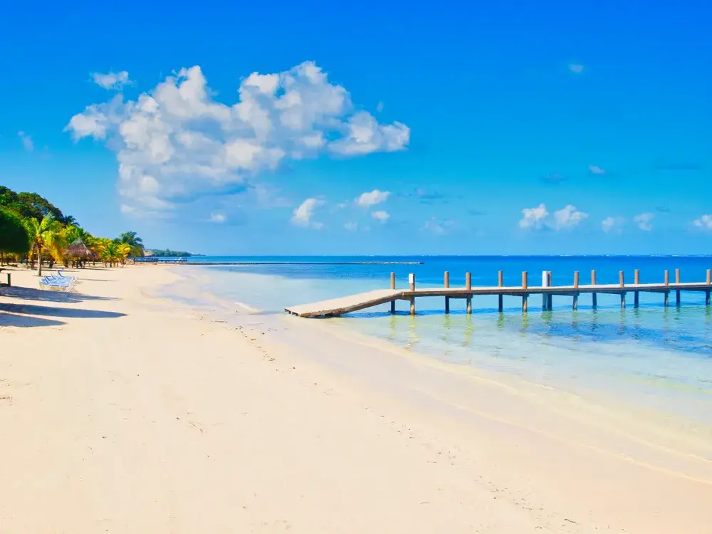 Neat view of the white sand beach in Roatan pictured during the best time to visit