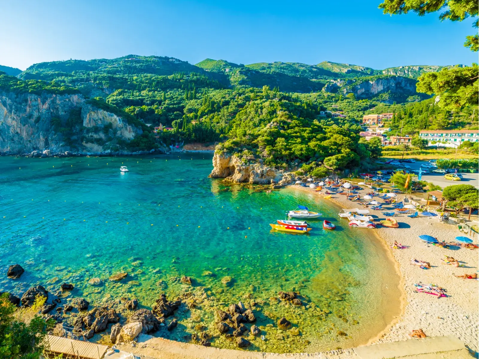 Paleokastritsa, Corfu, a top pick for the best beach in Greece, with gorgeous teal water and lush greenery around the coast