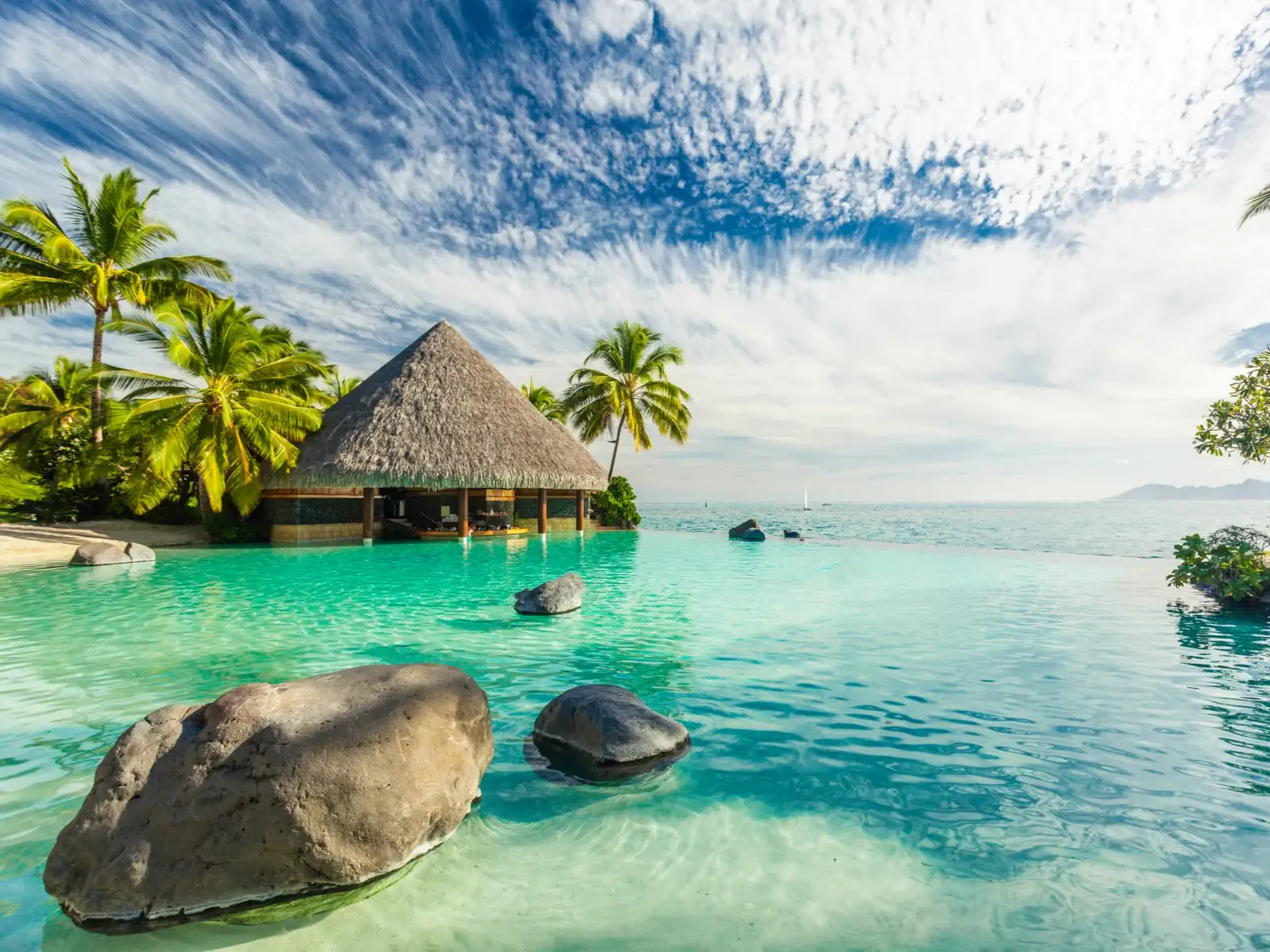 Infinity pool showing why you should visit Tahiti with gorgeous clear water and tropical views