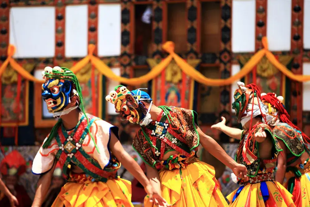 Traditional Bhutan Tibetan dance in Mongar showing why you should visit Bhutan for festivals