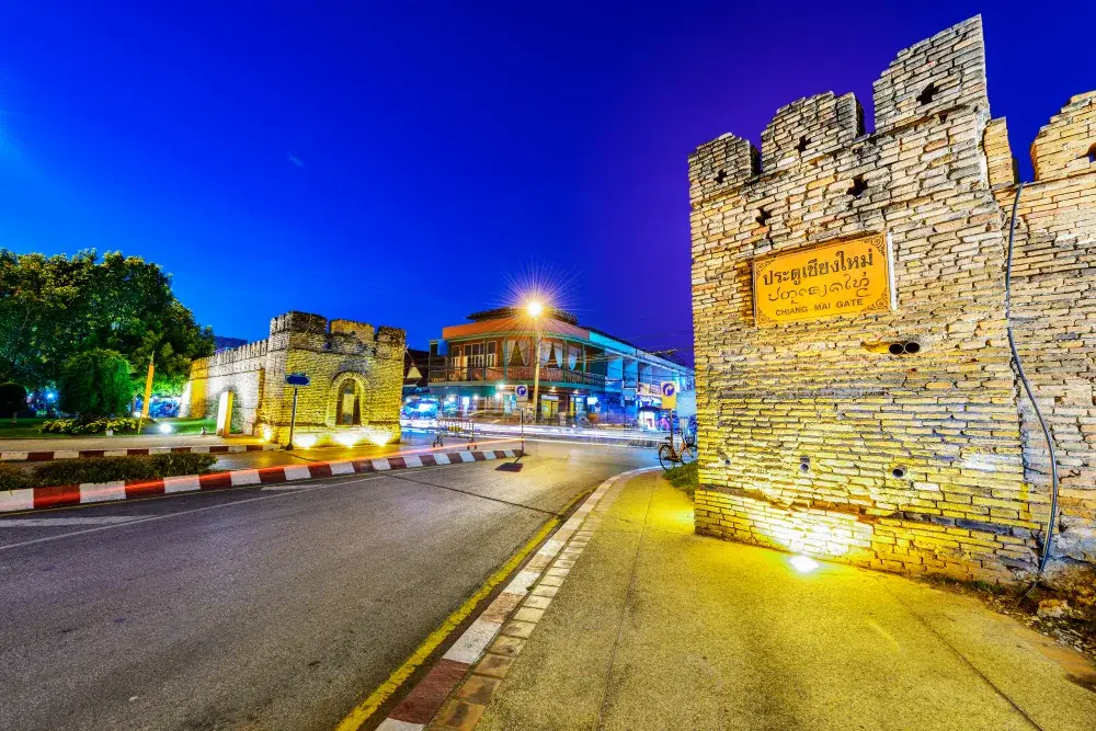 Night view of the historic west gate in Chiang Mai, one of the best places to visit in Thailand