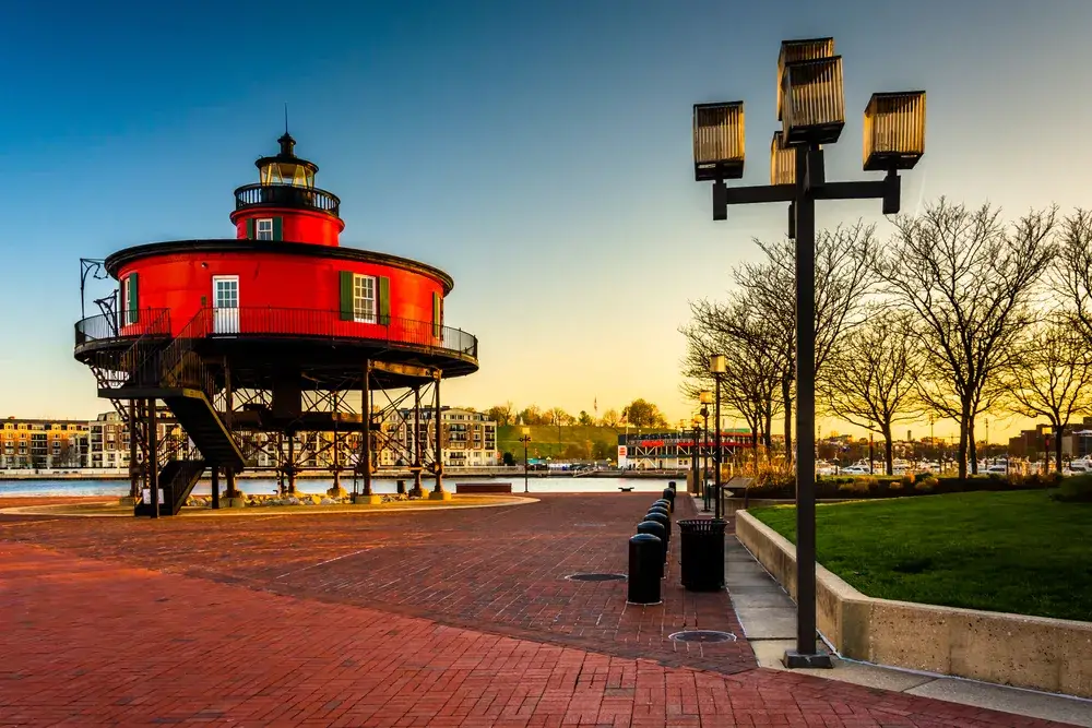 Seven Foot Knoll Lighthouse at sunset, at the Inner Harbor in Baltimore, Maryland. for a piece titled Is Baltimore Safe to Visit