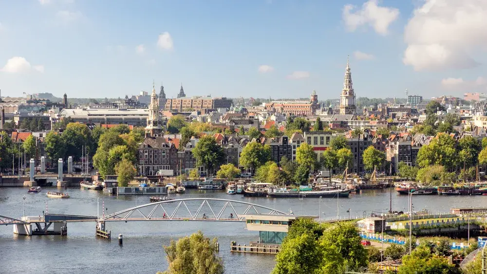 View over the city and canals for a frequently asked questions section answering the question Is Amsterdam Safe