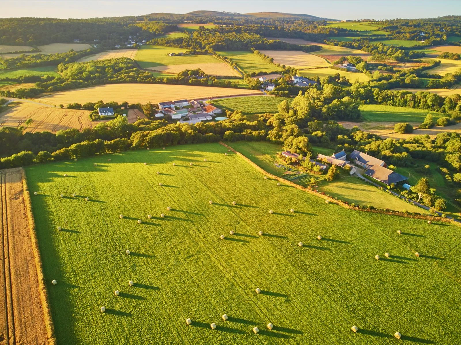 For a piece on the least expensive time to visit France, aerial view of farmlands and countryside in Brittany