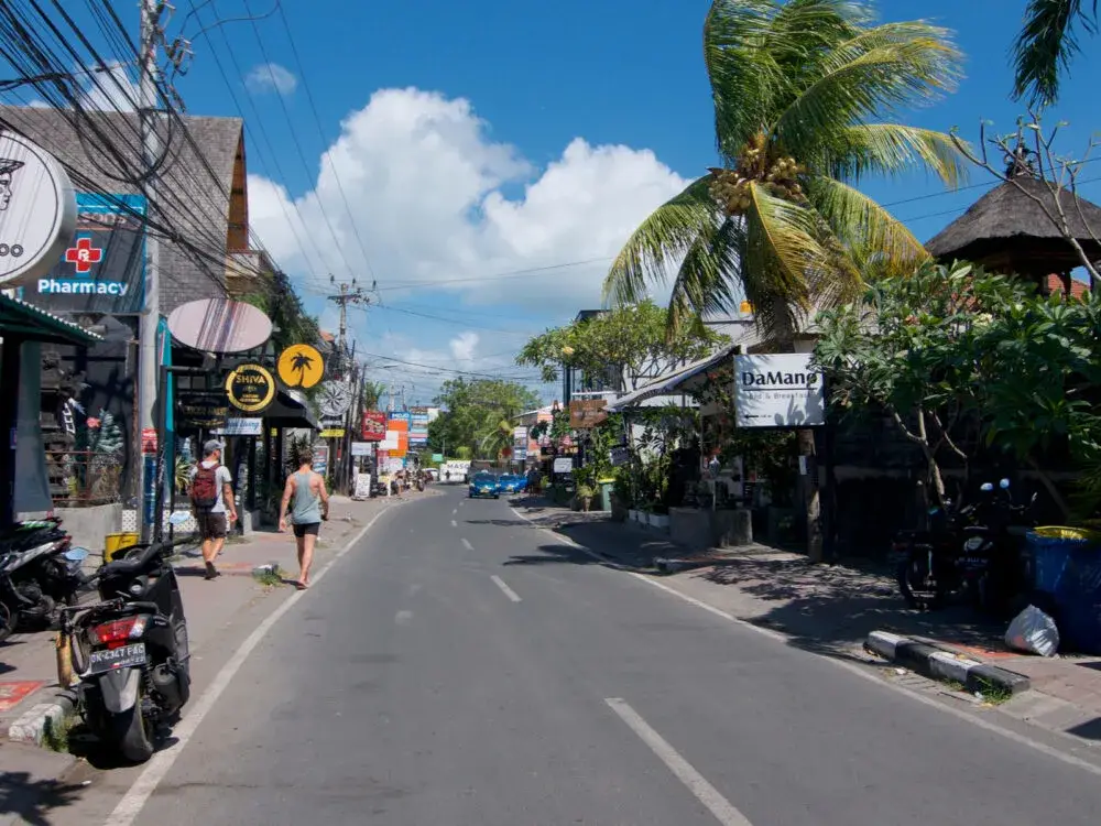 Canggu street with shops on either side of the street pictured for a post on whether or not Bali is safe