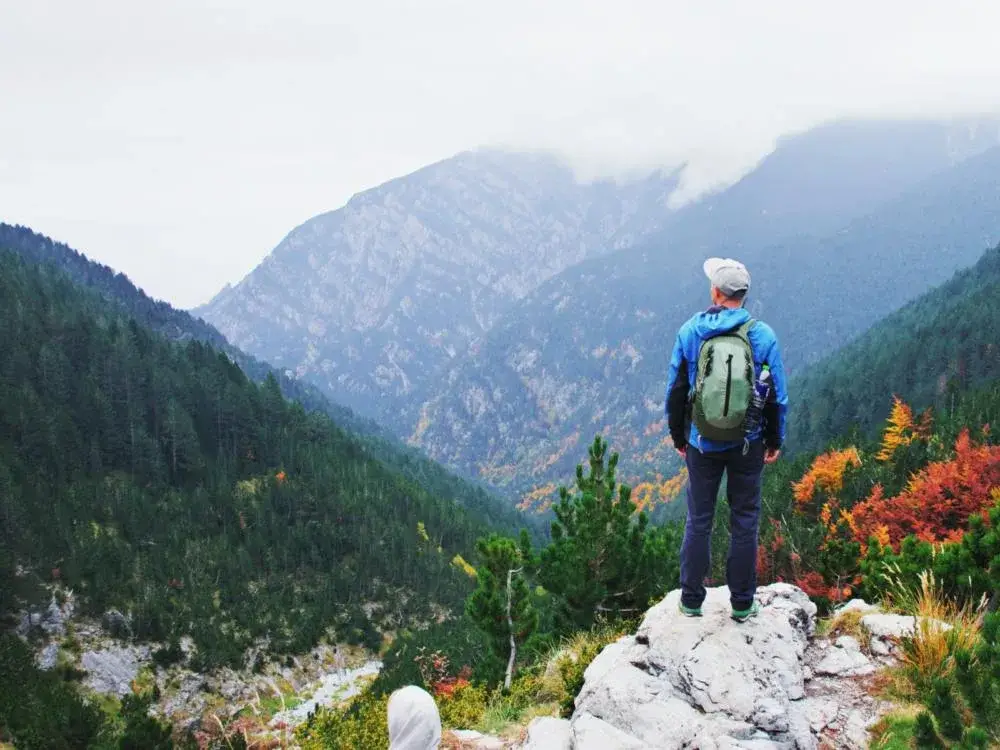 Guy hiking Mount Olympus, one of the best things to do in Greece