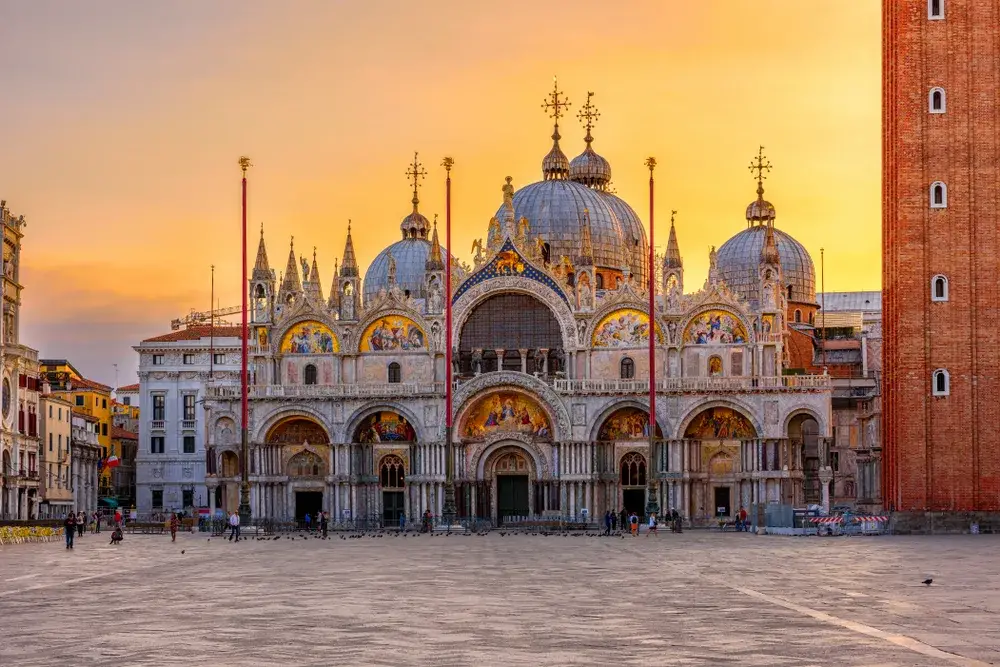 Image of Basilica di San Marco on Piazza San Marco at sunset during the cheapest time to visit Venice
