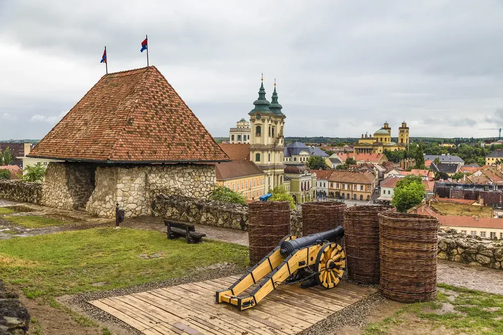 City walls with lookout tower and cannon around the historic center of Eger during the least busy time to visit Hungary 