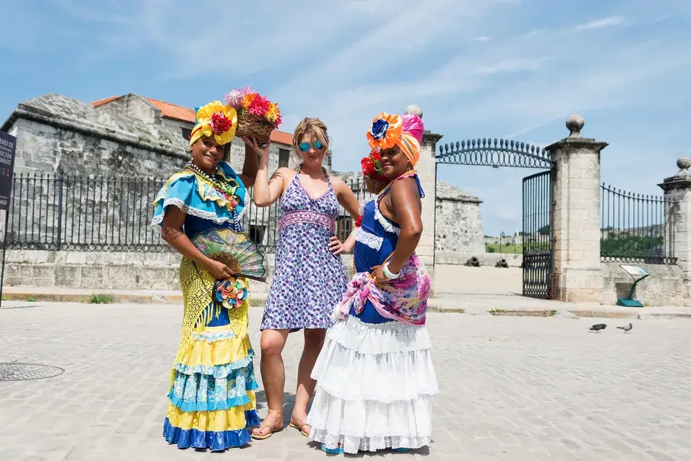 Cute blonde in Havana pictured with two Cuban women