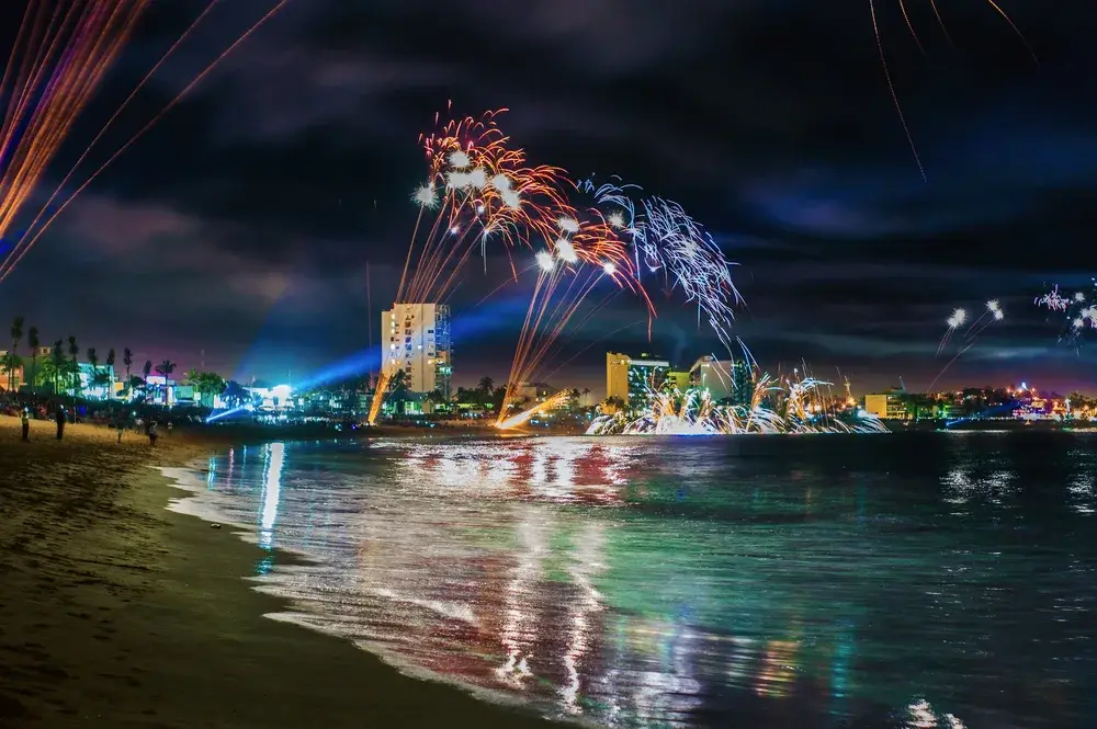 Fireworks on the beach of Mazatlan seen from the coast seen in a low-exposure image