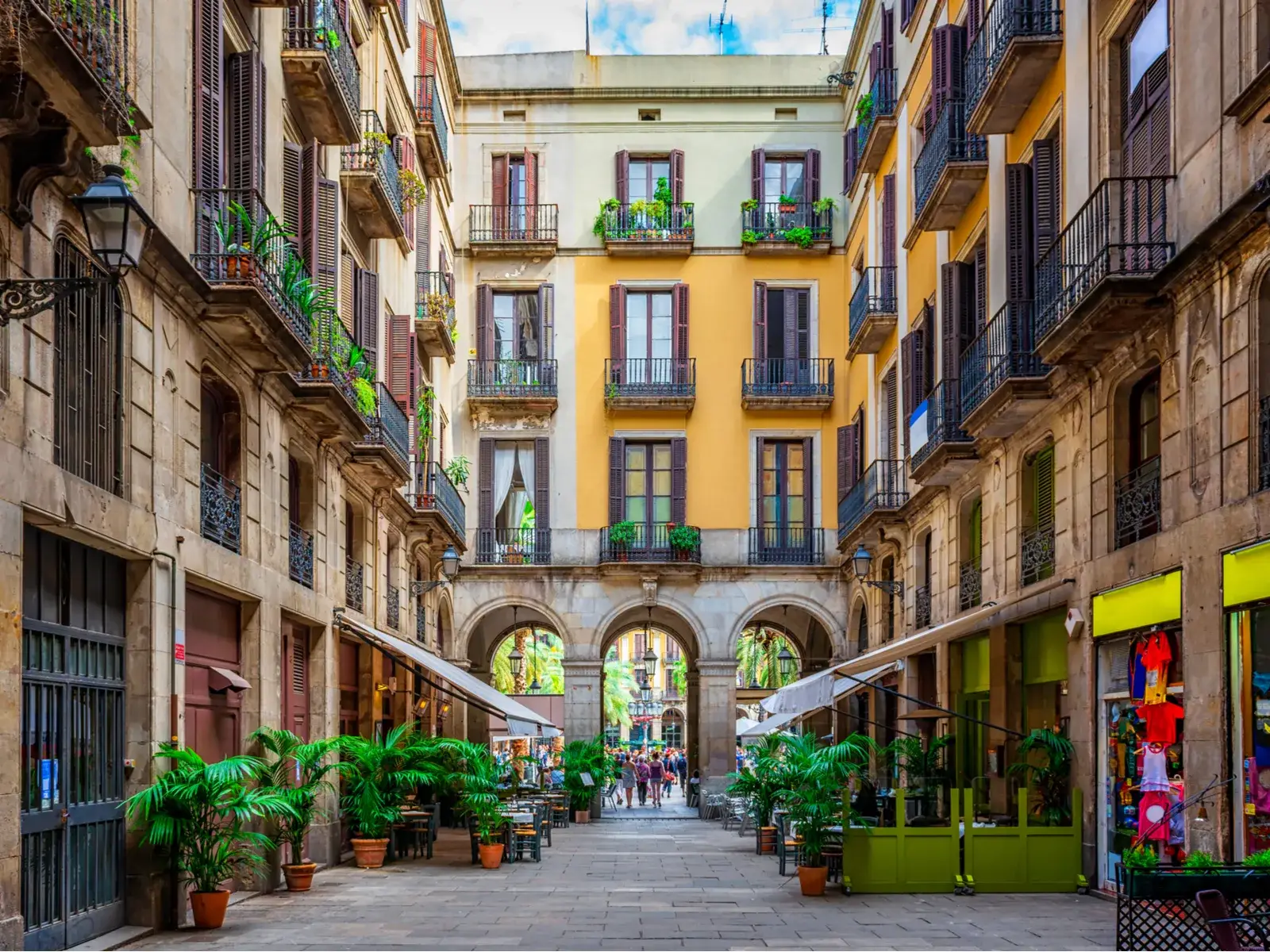 To illustrate the best time to visit Barcelona, a neat and narrow old street in Catalonia is pictured