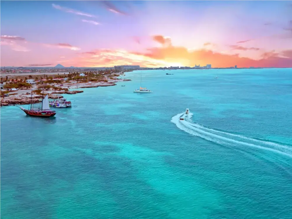 Gorgeous aerial shot of an Aruba beach during sunset during the best time to visit the Caribbean