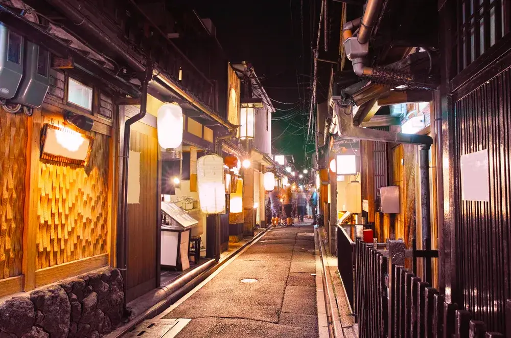 People walking around the Pontocho district in Kyoto at night to illustrate that it is safe to visit